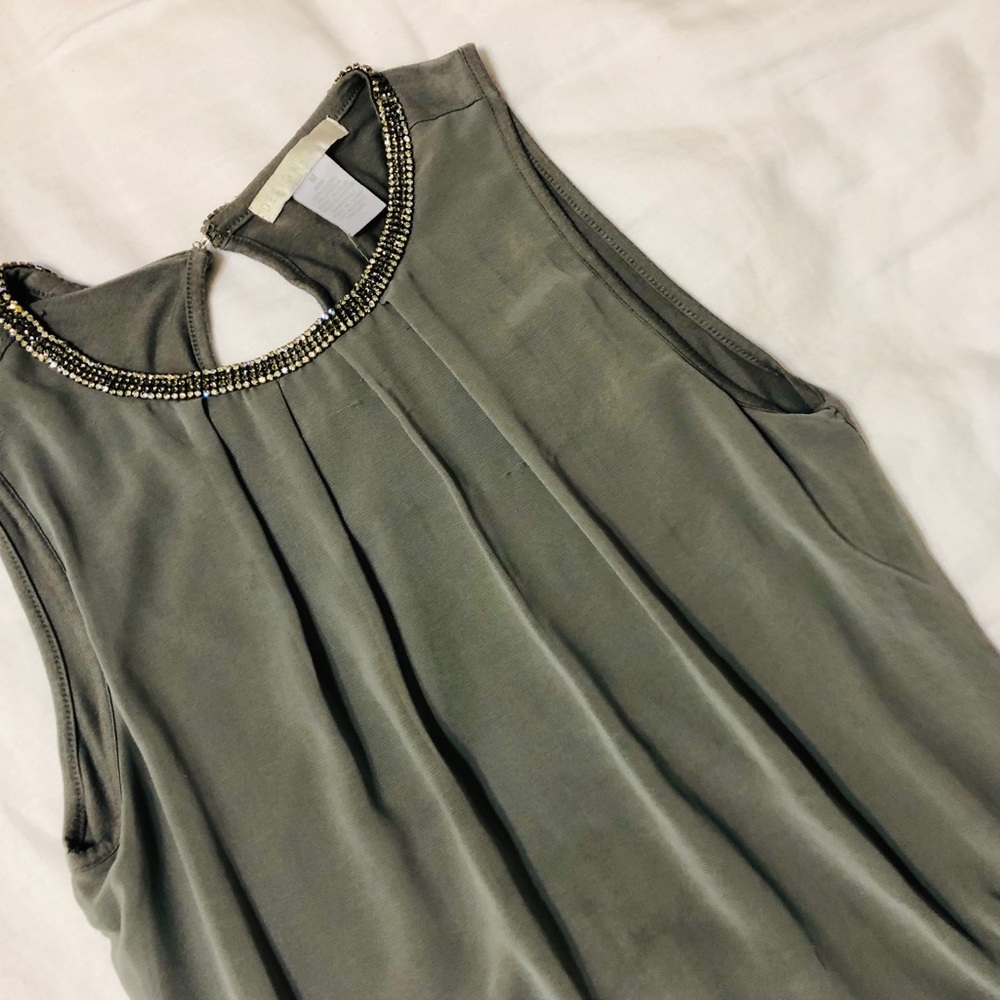 Gray sleeveless silky top with a jeweled collar